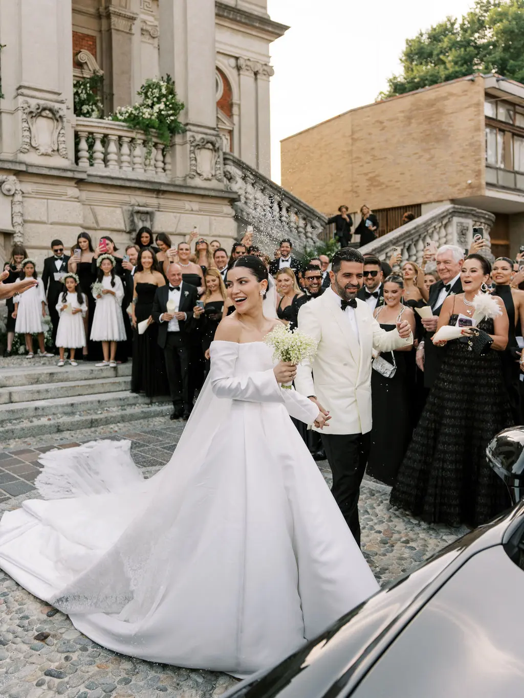 Bruna and Manoel leaving their wedding ceremony in Como