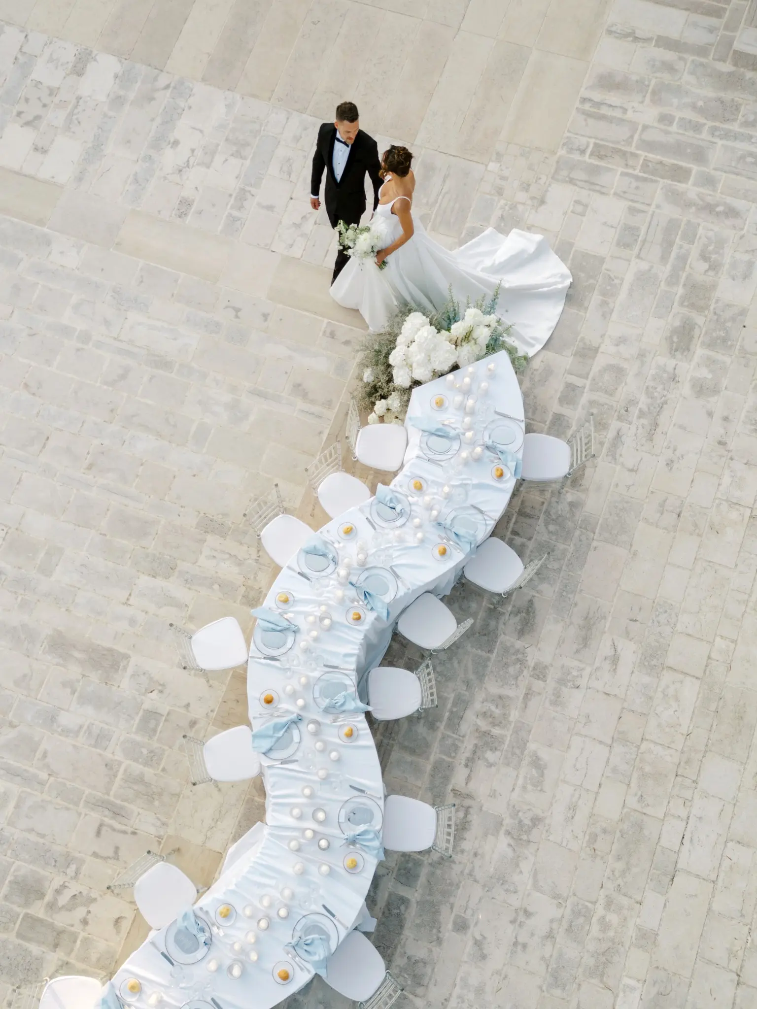 Darcy and Mathew beside their wedding table in Puglia