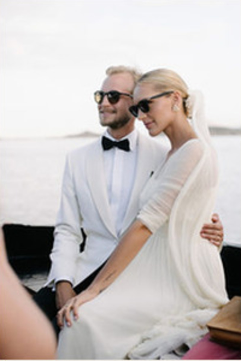 A newly married couple on a boat off the Sardinian coast